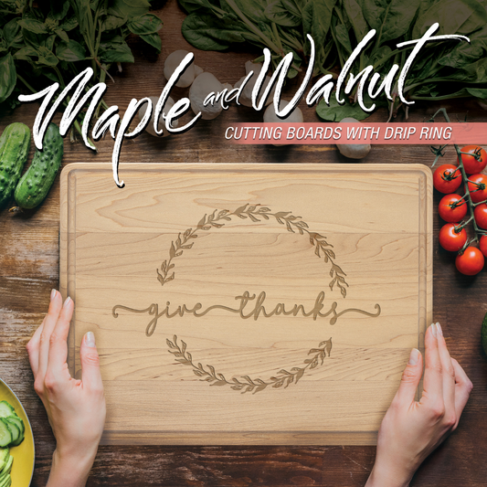 Wooden cutting board with 'give thanks' engraving on a wooden surface with vegetables.